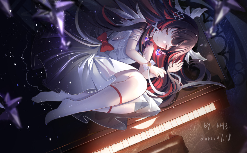 1girl bare_shoulders black_hair blurry closed_eyes closed_mouth columbina_(genshin_impact) crescent depth_of_field dress facing_viewer fetal_position genshin_impact grand_piano head_wings highres instrument lying miaogujun multicolored_hair no_mask on_side piano redhead sleeveless sleeveless_dress smile socks solo streaked_hair two-tone_hair white_dress white_socks