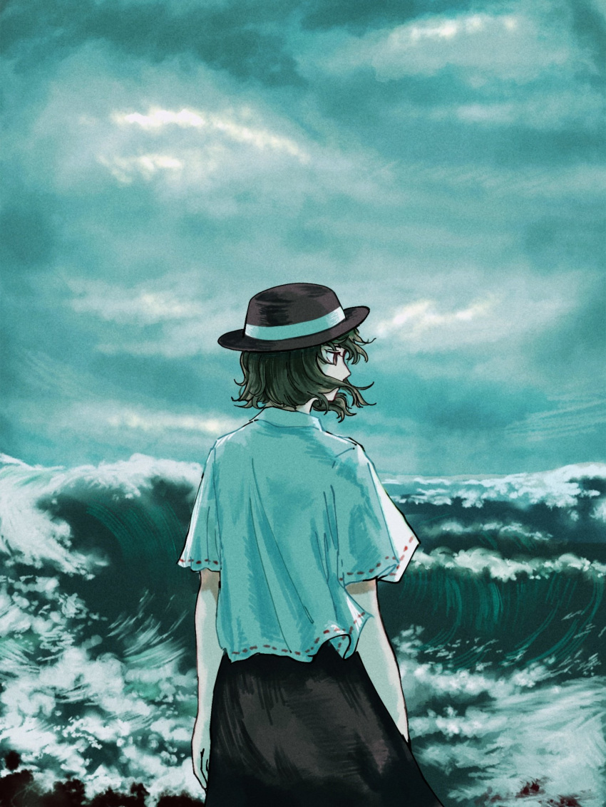 1girl bangs black_hair black_headwear black_skirt brown_eyes clouds cloudy_sky commentary_request fedora feet_out_of_frame foaming_waves from_behind grey_sky hair_over_mouth hair_ribbon hat highres kihaji140 looking_to_the_side ocean ribbon shirt short_hair short_sleeves skirt sky solo touhou usami_renko waves white_ribbon white_shirt