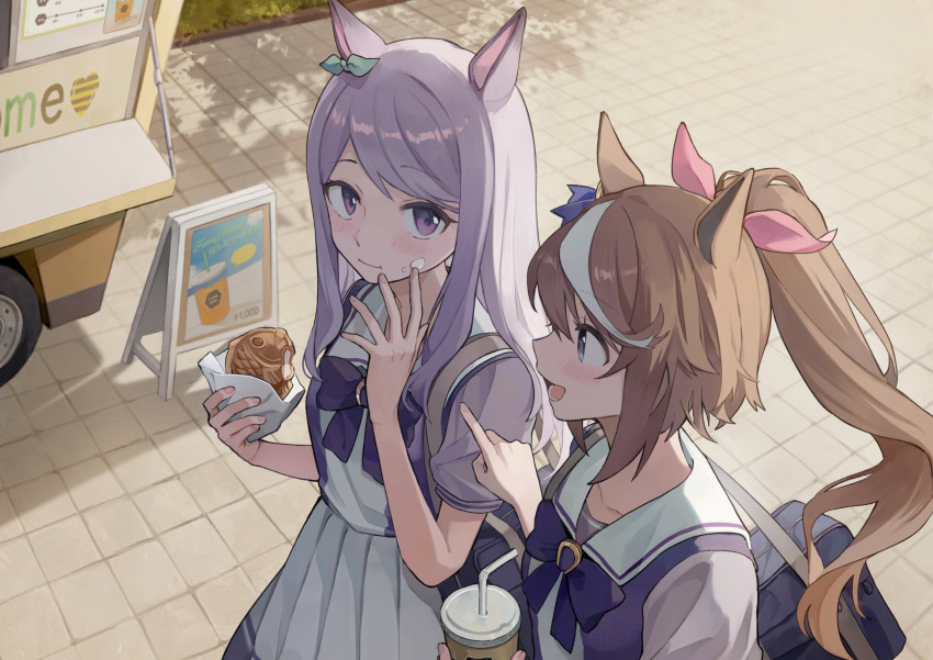 2girls animal_ears bag bangs blue_eyes brown_hair closed_mouth cup dango_(uni_520) disposable_cup food food_on_face food_truck hand_up highres holding holding_cup holding_food horse_ears long_hair looking_at_viewer mejiro_mcqueen_(umamusume) multicolored_hair multiple_girls open_mouth outdoors pleated_skirt pointing ponytail purple_hair purple_shirt school_bag school_uniform shirt short_sleeves shoulder_bag skirt smile streaked_hair taiyaki tokai_teio_(umamusume) tracen_school_uniform umamusume violet_eyes wagashi white_skirt