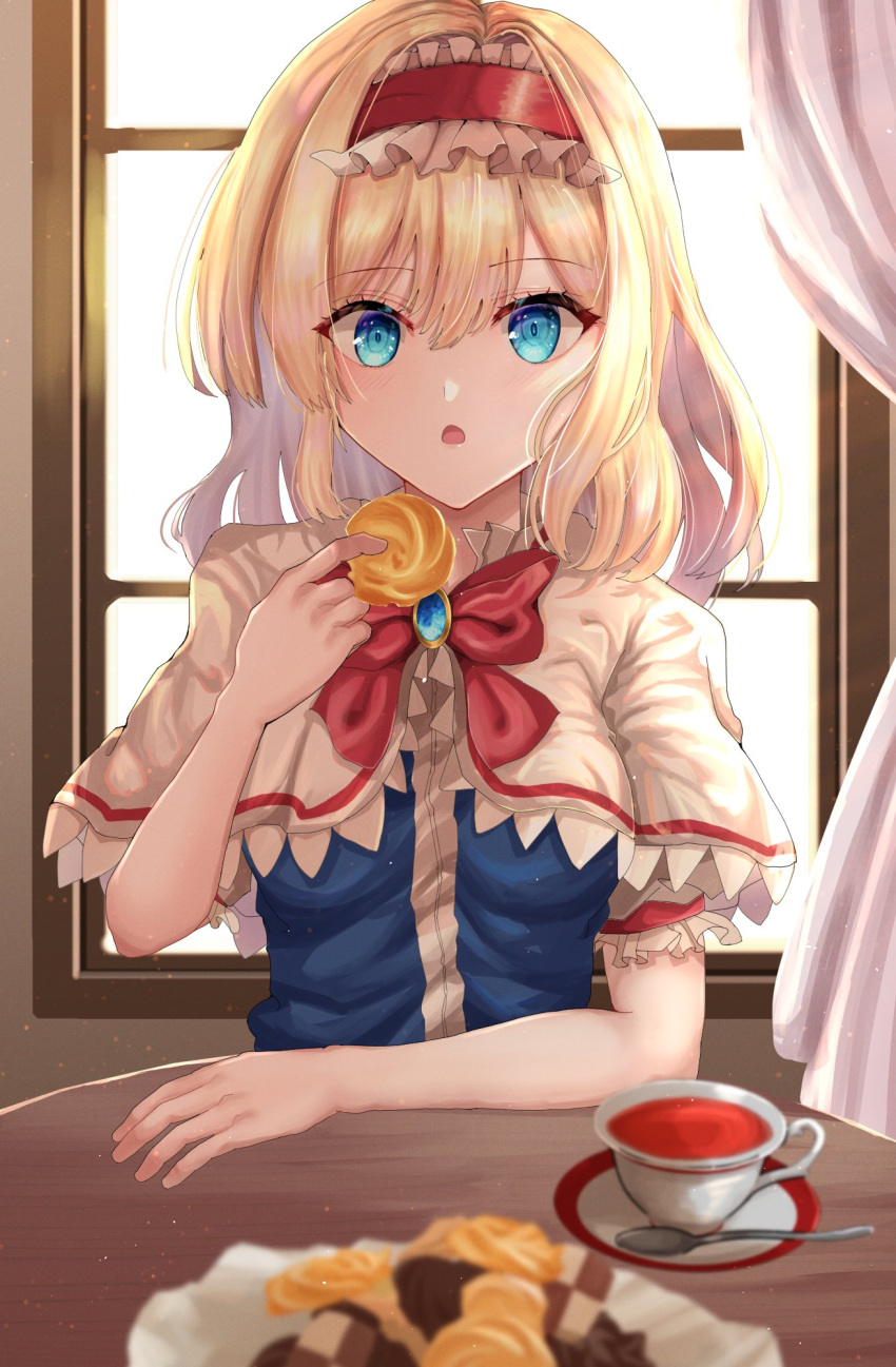 1girl alice_margatroid bangs blonde_hair blue_dress blue_eyes blurry blush bow bowtie breasts candy capelet chocolate commentary_request cookie cup curtains dress erisauria eyes_visible_through_hair food frills gem grey_capelet grey_shirt hair_between_eyes hairband hand_up highres indoors jewelry light looking_at_viewer medium_breasts open_mouth plate puffy_short_sleeves puffy_sleeves red_bow red_bowtie red_hairband shadow shirt short_hair short_sleeves sitting solo spoon sunlight table tea touhou wall window