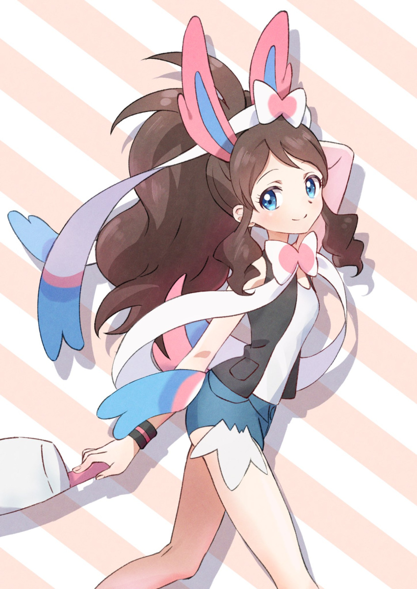 1girl animal_ears arm_behind_head baseball_cap blue_eyes brown_hair cosplay hat headwear_removed highres hilda_(pokemon) neck_ribbon nyam_suima pokemon pokemon_(game) pokemon_bw ponytail ribbon shirt short_shorts shorts sleeveless smile striped striped_background sylveon sylveon_(cosplay) white_shirt