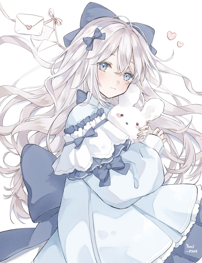 1girl artist_name bangs blue_bow blue_dress blue_eyes bow closed_mouth detached_sleeves dress frilled_dress frilled_sleeves frills hair_between_eyes hair_bow heart highres holding holding_stuffed_toy large_bow light_blush long_hair long_sleeves looking_at_viewer love_letter lying on_side original ribbon signature simple_background sleeves_past_wrists solo stuffed_animal stuffed_bunny stuffed_toy wavy_hair white_background white_hair yuni_0205