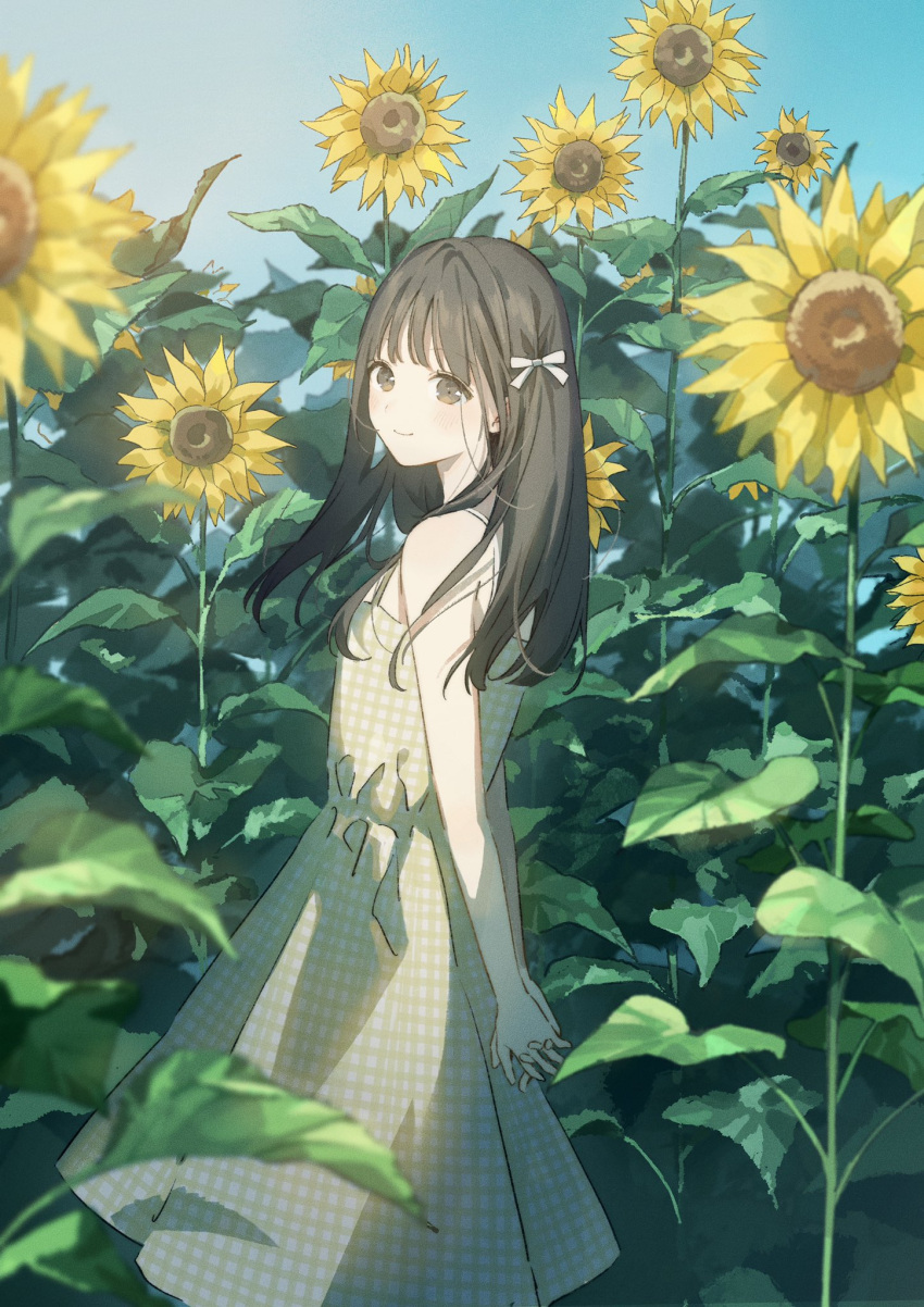 1girl arms_behind_back bangs bare_shoulders blue_sky blush brown_eyes brown_hair closed_mouth dress flower hair_ribbon highres long_hair looking_back original outdoors own_hands_together ribbon sako_(35s_00) sky sleeveless sleeveless_dress smile solo standing sunflower yellow_dress yellow_flower