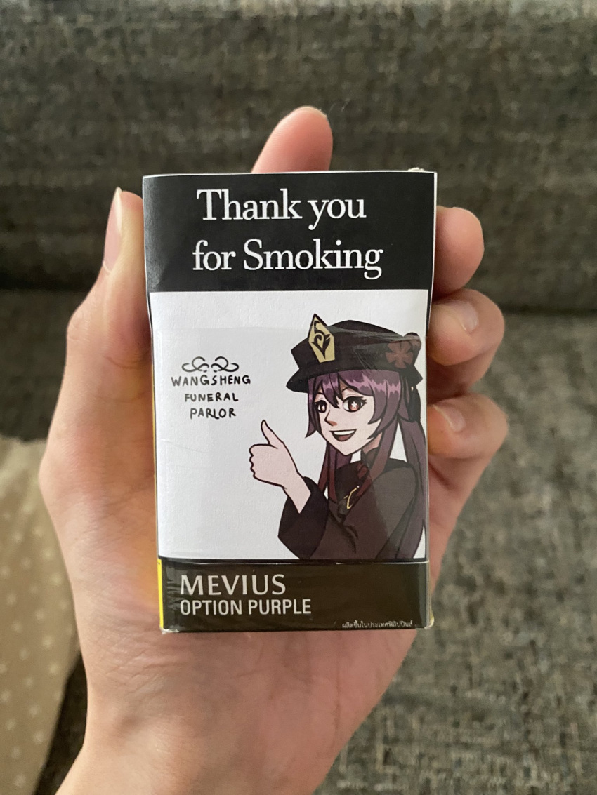 1girl :d bangs blurry blurry_background brown_hair cigarette_pack commentary couch flower genshin_impact hair_between_eyes hand_focus hand_up hat hat_flower highres holding_cigarette_pack hu_tao_(genshin_impact) jewelry leslie1861 long_hair long_sleeves looking_at_viewer photo_(medium) pov pov_hands red_eyes smile symbol-shaped_pupils thumbs_up twintails