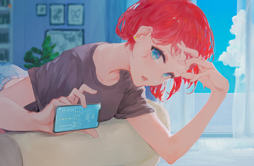 1girl arm_up belt blue_eyes cellphone clouds curtains highres holding holding_phone indoors kisei2 looking_at_viewer lying on_stomach open_mouth original phone plant purple_shirt redhead shirt short_hair short_sleeves smartphone solo t-shirt