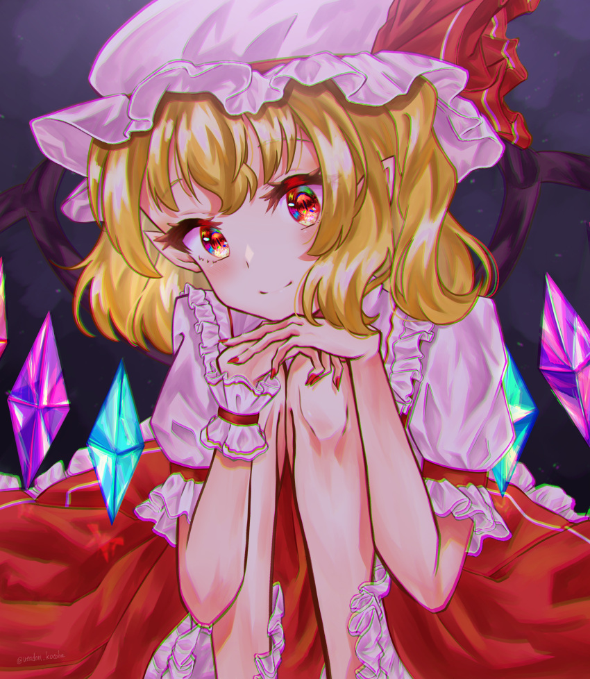 1girl absurdres blonde_hair chromatic_aberration closed_mouth crystal flandre_scarlet frilled_shirt_collar frilled_sleeves frills gagaku_kawa_rei hands_on_own_knees hat hat_ribbon head_tilt highres looking_at_viewer medium_hair mob_cap multicolored_wings nail_polish puffy_short_sleeves puffy_sleeves red_eyes red_nails red_ribbon ribbon shirt short_sleeves smile solo touhou white_headwear white_shirt wings wrist_cuffs