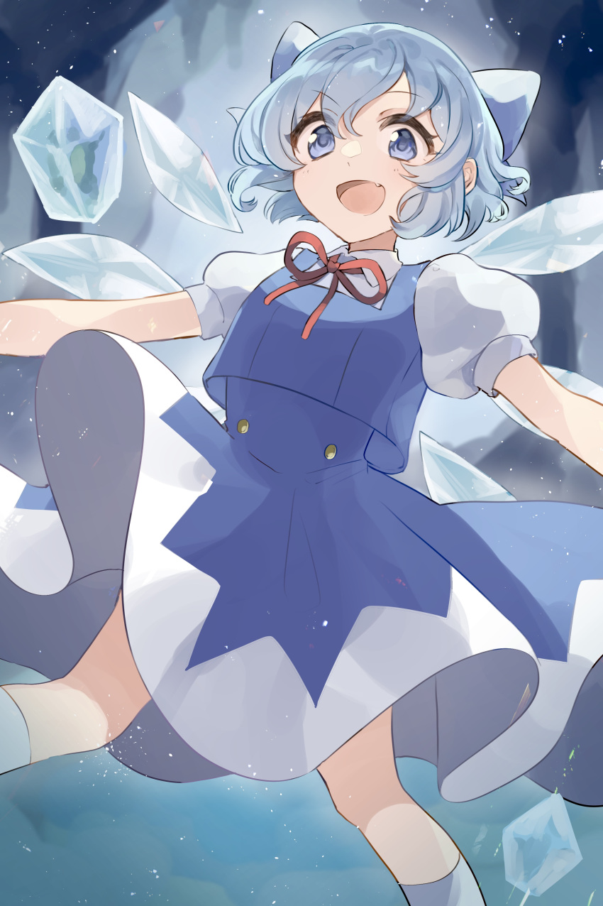 1girl :d absurdres arms_at_sides bangs bare_legs blue_bow blue_eyes blue_hair blue_skirt blue_vest blurry blurry_background bow buttons cirno collared_shirt detached_wings fang floating hair_bow highres ice ice_wings light_blue_hair light_particles looking_at_viewer neck_ribbon open_mouth puffy_short_sleeves puffy_sleeves red_ribbon ribbon rin_(yukameiko) shirt short_hair short_sleeves skirt smile solo touhou two-tone_skirt vest white_shirt white_skirt wings
