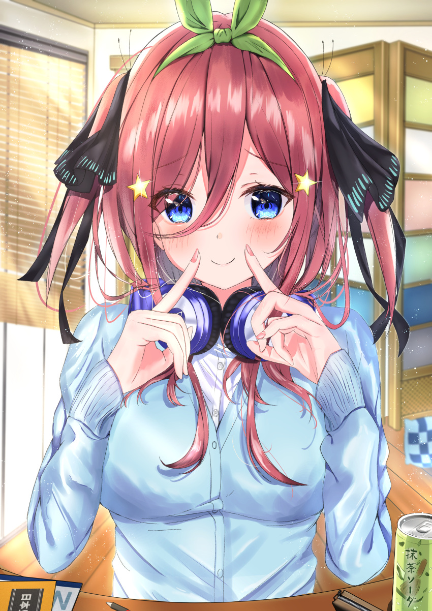 1girl absurdres black_ribbon blinds blue_cardigan blue_eyes blush borrowed_garments breasts brown_hair butterfly_hair_ornament can cardigan closed_mouth fingersmile go-toubun_no_hanayome green_headband hair_between_eyes hair_ornament hands_up headband headphones headphones_around_neck highres indoors large_breasts long_hair long_sleeves nakano_miku notebook pen pink_nails rain_sunny ribbon school_uniform shirt sidelocks smile soda_can solo star_(symbol) star_hair_ornament two_side_up upper_body white_shirt
