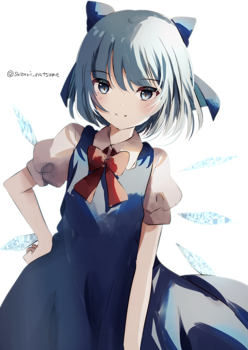 1girl bangs blue_bow blue_dress blue_eyes blue_hair bow bowtie cirno closed_mouth collared_shirt dress fairy hair_bow hand_on_hip highres ice ice_wings natsume_suzuri pinafore_dress red_bow red_bowtie shirt short_hair short_sleeves simple_background smile solo touhou twitter_username white_background white_shirt wings
