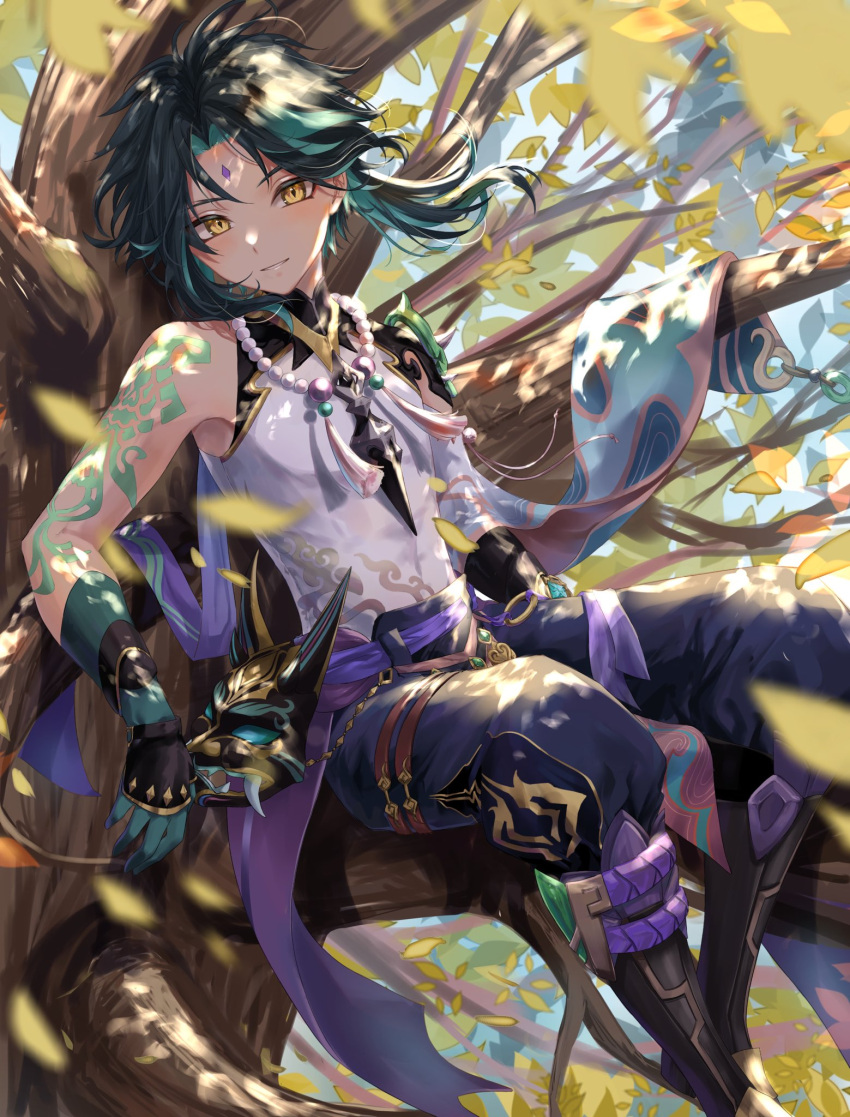 1boy arm_tattoo bangs bead_necklace beads bishounen branch commentary_request facial_mark forehead_mark genshin_impact gloves green_hair highres jewelry looking_at_viewer male_focus multicolored_hair necklace outdoors sitting sitting_on_branch smile solo tassel tattoo teeth tree una_kamra wind xiao_(genshin_impact) yellow_eyes