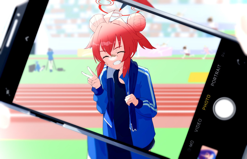 1girl ahoge bangs blue_archive blue_shirt blue_track_suit blurry closed_eyes cowboy_shot depth_of_field double_bun grin hair_bun halo highres holding holding_towel jacket maki_(blue_archive) mimuyochi redhead running_track shirt sidelocks smile solo sweat teeth towel towel_around_neck track_and_field track_jacket v viewfinder