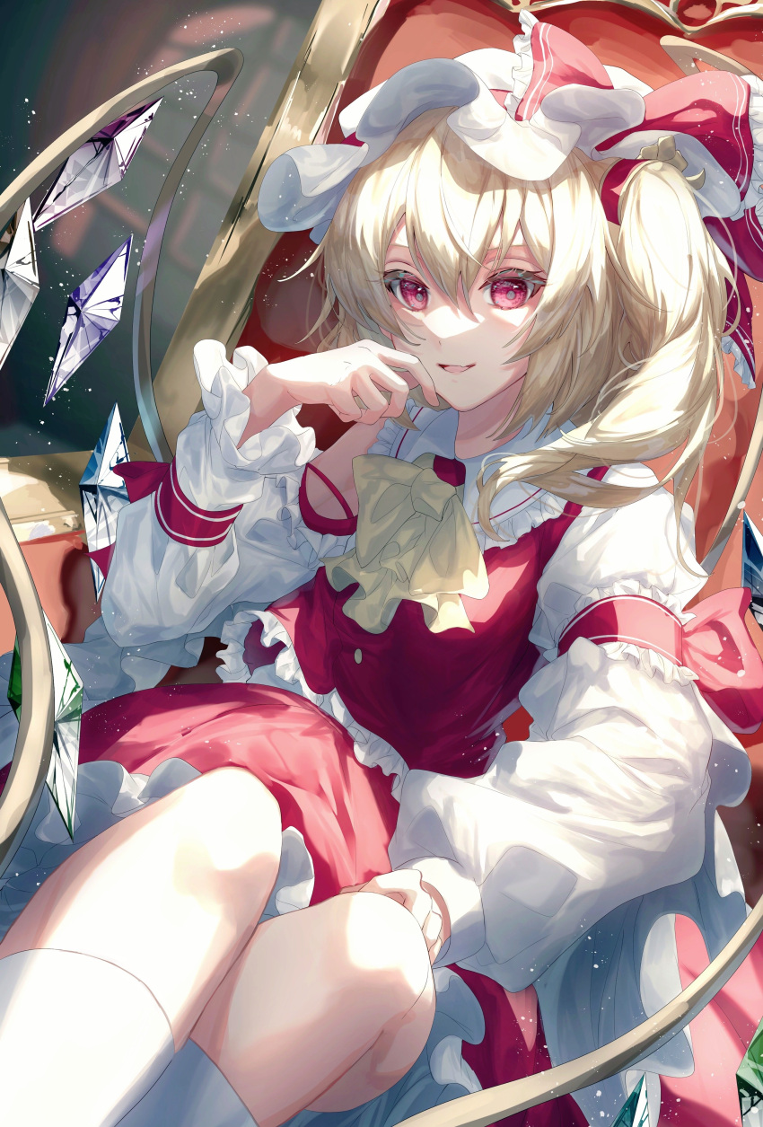 1girl absurdres ascot blonde_hair bow commentary_request crystal fang flandre_scarlet frilled_ascot frilled_bow frilled_shirt_collar frilled_skirt frilled_sleeves frilled_vest frills hat hat_bow highres juliet_sleeves kneehighs long_sleeves medium_hair mob_cap on_chair open_mouth parted_lips puffy_sleeves red_bow red_eyes red_skirt red_vest shirt side_ponytail sitting skin_fang skirt sleeve_garter socks solo toku_kekakewanko touhou vest white_headwear white_shirt white_socks wings yellow_ascot