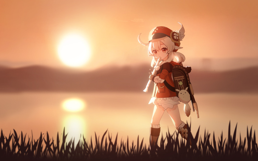 1girl absurdres ahoge backpack bag blonde_hair bloomers boots brown_footwear brown_gloves dress evening genshin_impact gloves grass h1910984490 hat hat_feather highres instrument klee_(genshin_impact) knee_boots long_hair low_twintails music outdoors playing_instrument pointy_ears recording red_dress red_eyes red_headwear reflection short_dress sky solo sun sunset twintails underwear walking water white_bloomers