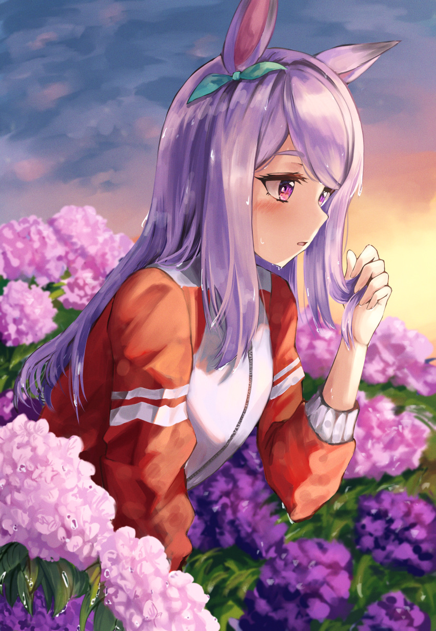 1girl absurdres animal_ears aqua_bow bow ear_bow field flower flower_field flower_request futakaze_(yrmv7377) highres holding holding_hair horse_ears horse_girl jacket long_hair mejiro_mcqueen_(umamusume) outdoors purple_hair red_track_suit solo tracen_training_uniform track_jacket umamusume violet_eyes