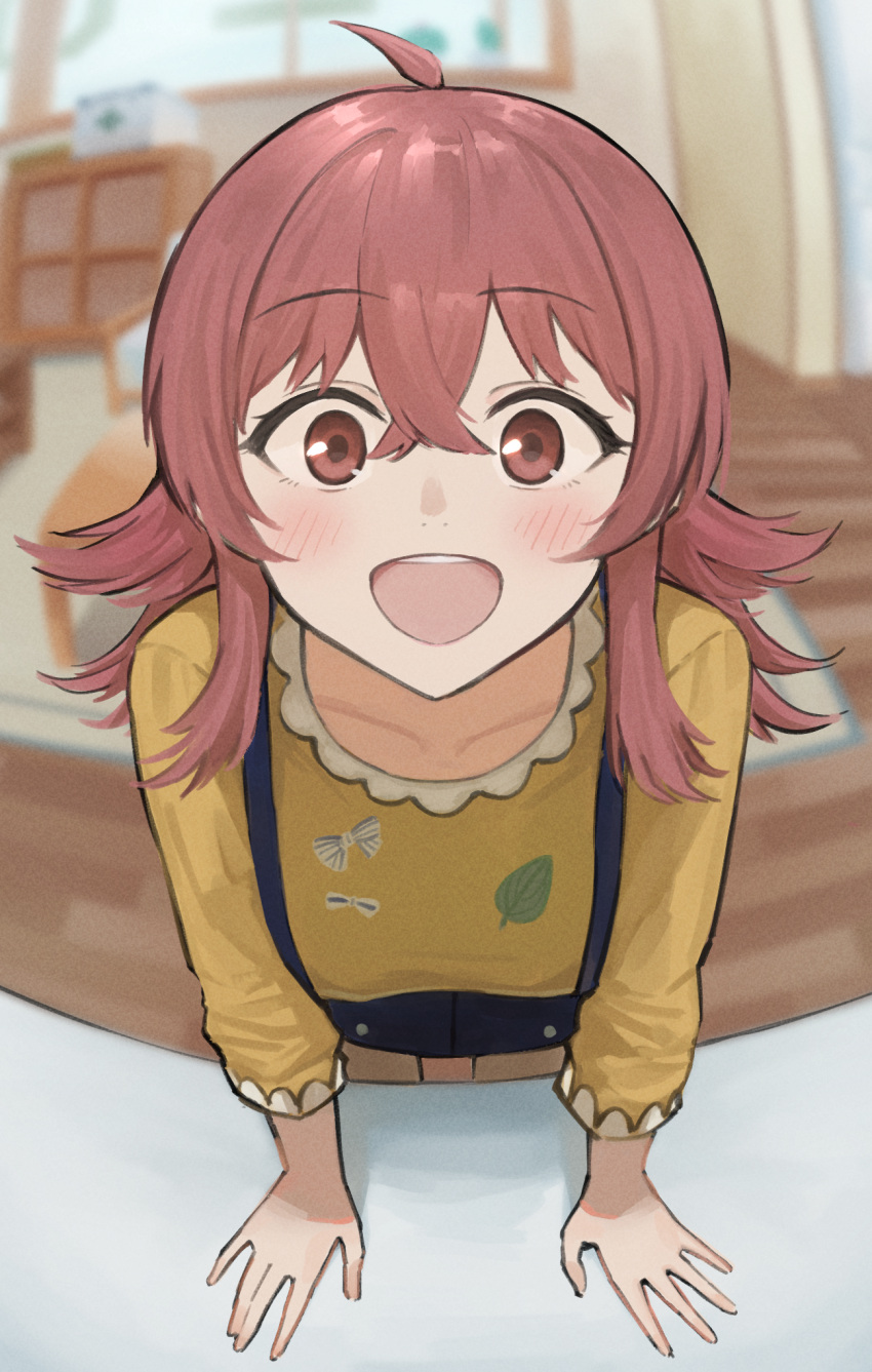 1girl ahoge amepa blurry blurry_background carpet collarbone happy highres idolmaster idolmaster_shiny_colors indoors komiya_kaho leaning_on_table long_hair long_sleeves looking_at_viewer open_mouth red_eyes redhead shirt smile table window yellow_shirt