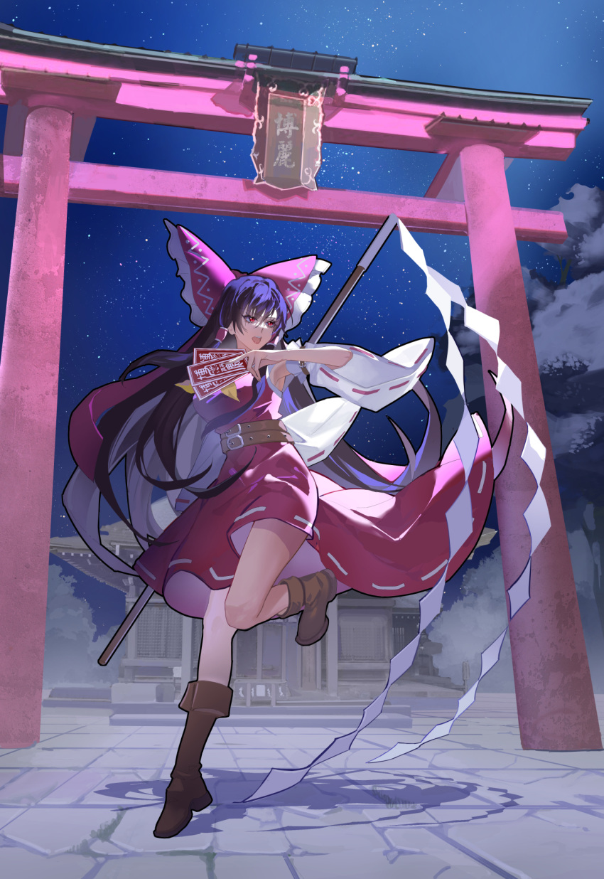 1girl arm_belt arm_up bangs belt black_hair boots bow brown_footwear commentary_request detached_sleeves dress frilled_bow frills full_body gohei hair_bow hakurei_reimu hakurei_shrine highres holding_gohei kaoru_(alicemakoto) long_hair night ofuda open_mouth red_bow red_dress red_eyes ribbon-trimmed_sleeves ribbon_trim shide sky solo standing standing_on_one_leg star_(sky) starry_sky torii touhou tree white_sleeves wide_sleeves
