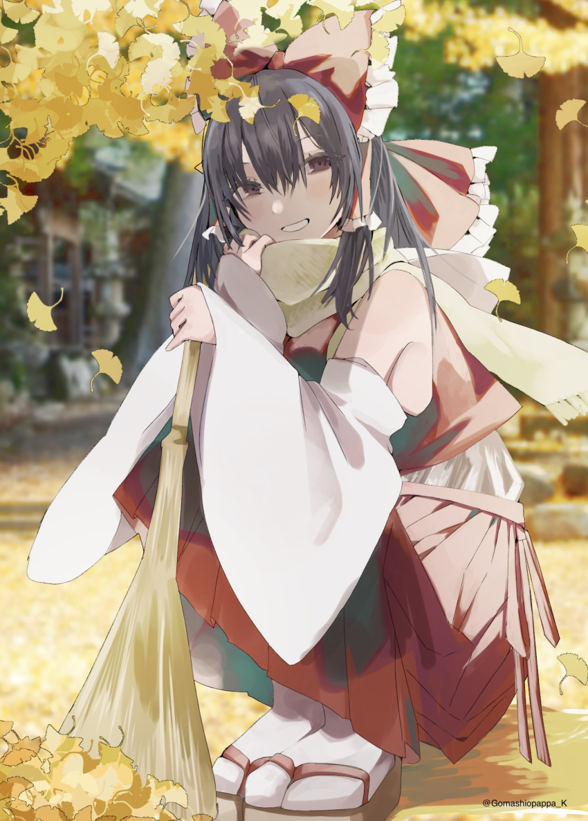 1girl bare_shoulders black_hair bow broom brown_eyes commentary_request detached_sleeves frilled_bow frilled_hair_tubes frills gomashiopappa_k grin hair_bow hair_tubes hakurei_reimu happy head_tilt highres holding holding_broom leaf long_hair long_skirt long_sleeves looking_at_viewer nontraditional_miko outdoors red_bow red_skirt red_vest sandals scarf sidelocks skirt smile socks solo squatting tabi touhou vest white_sleeves white_socks wide_sleeves yellow_scarf