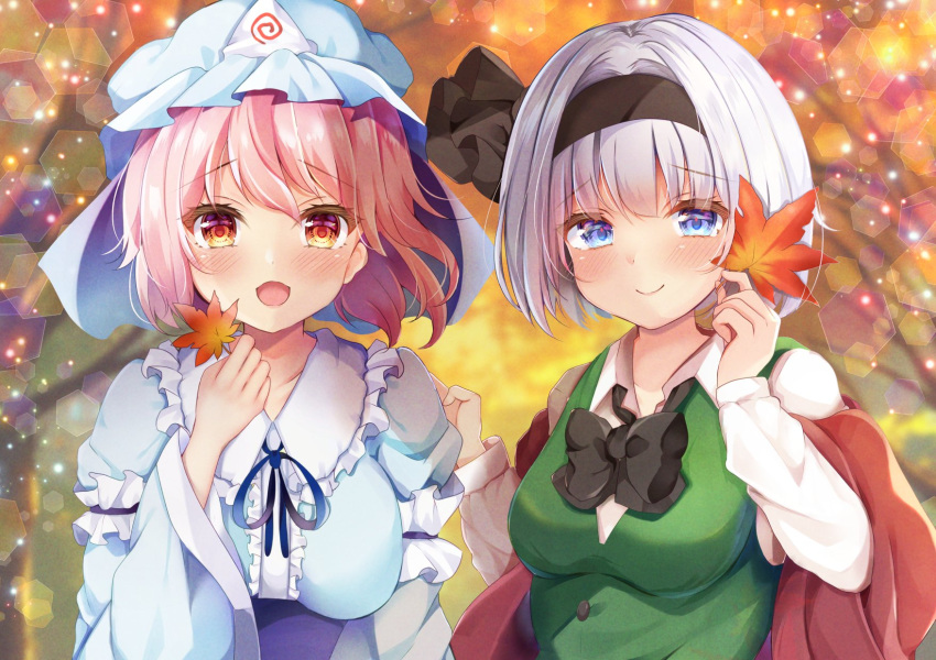 2girls black_bow black_bowtie black_hairband blue_eyes blue_headwear blue_kimono bow bowtie breasts closed_mouth collarbone grey_hair hairband hat highres holding holding_leaf japanese_clothes kimono konpaku_youmu large_breasts leaf light_particles looking_at_viewer maple_leaf medium_breasts mob_cap multiple_girls open_mouth outdoors pink_hair red_eyes saigyouji_yuyuko shirotsuki_shirone short_hair smile touhou triangular_headpiece upper_body