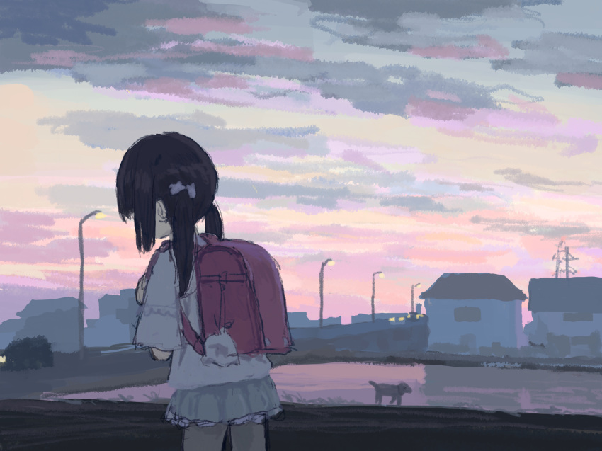 1girl animal backpack bag bag_charm black_hair building charm_(object) child cowboy_shot dusk facing_away female_child from_behind gradient_sky hair_ornament highres holding_strap lamppost long_hair low_twintails miniskirt original outdoors oyu petticoat pink_sky randoseru red_bag scenery short_sleeves skirt sky solo transmission_tower twilight twintails