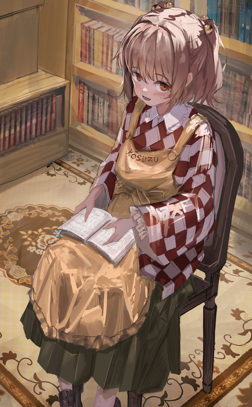 1girl absurdres apron bell black_footwear blush book bookshelf brown_hair carpet chair character_name checkered_clothes checkered_kimono clothes_writing commentary_request foot_out_of_frame frilled_sleeves frills green_skirt hair_bell hair_ornament henginnnnnn highres indoors japanese_clothes kimono long_sleeves looking_at_viewer medium_hair motoori_kosuzu open_book open_mouth orange_apron orange_eyes red_kimono sitting skirt solo touhou two_side_up white_kimono wide_sleeves