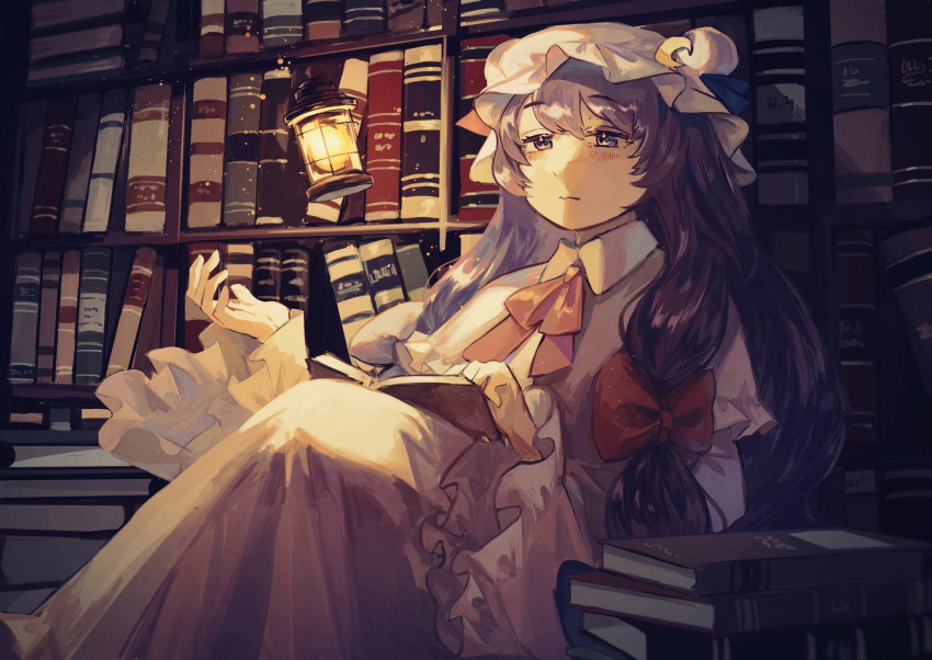 1girl bangs book book_stack bookshelf bow closed_mouth collared_dress commentary_request crescent crescent_hat_ornament dark double_bun dress frilled_sleeves frills hair_bow hair_bun hat hat_ornament highres indoors knees_up lantern long_hair long_sleeves mob_cap mushiao open_book patchouli_knowledge pink_ribbon purple_hair red_bow ribbon solo touhou violet_eyes white_dress white_headwear wide_sleeves