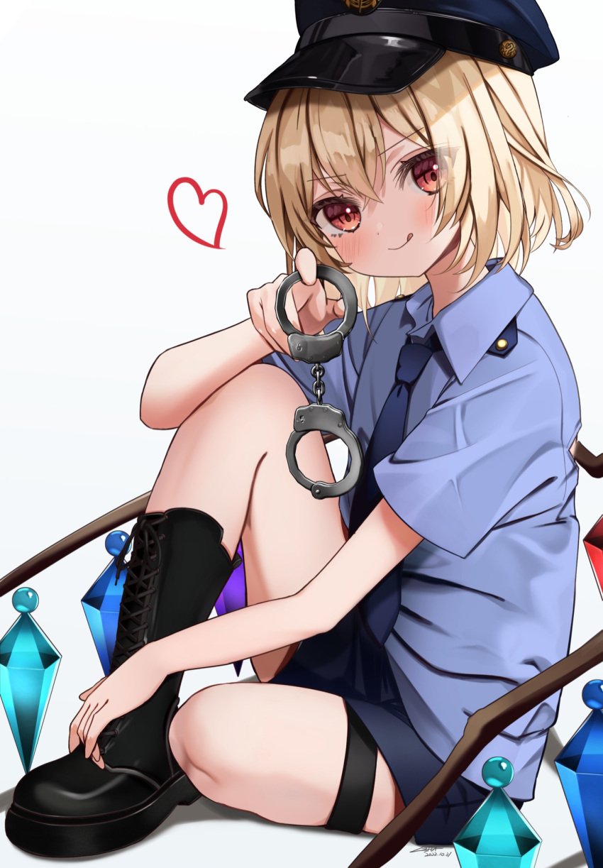 1girl black_footwear blonde_hair blue_shirt blue_skirt blush boots cross-laced_footwear crystal cuffs flandre_scarlet handcuffs hat highres holding medium_hair police police_hat police_uniform red_eyes shirt short_sleeves simple_background sitting skirt solo thigh_strap tongue tongue_out touhou uniform white_background wings yuineko