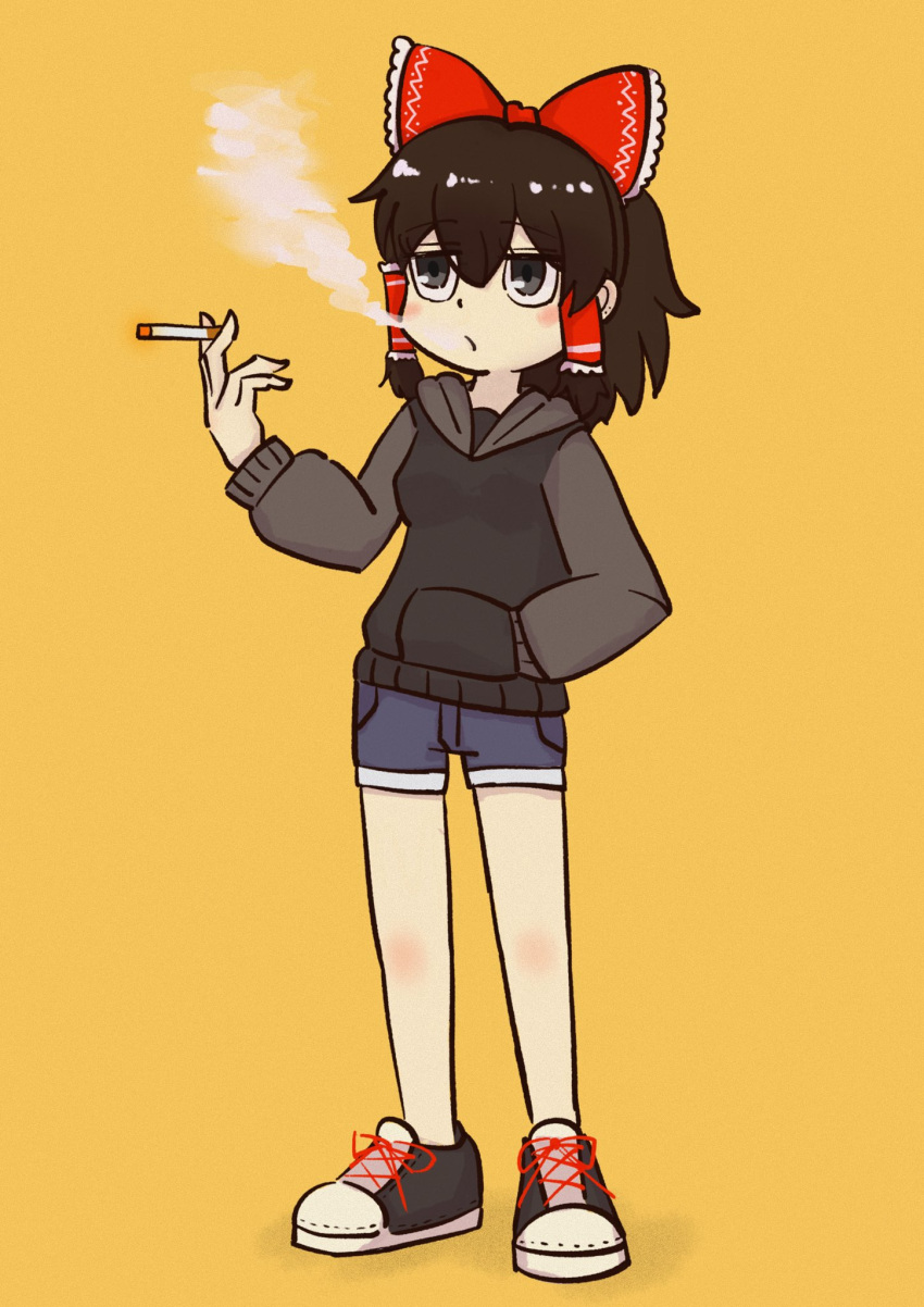 1girl bad_id bad_twitter_id bangs black_eyes black_footwear black_hair black_hoodie blue_shorts blush bow breasts cigarette commentary_request cookie_(touhou) frilled_bow frilled_hair_tubes frills full_body hair_between_eyes hair_bow hair_tubes hakurei_reimu hand_in_pocket highres holding holding_cigarette hood hood_down hoodie looking_afar maru_(cookie) medium_hair open_mouth red_bow shoes short_shorts shorts simple_background small_breasts smoke smoking sneakers solo standing touhou yellow_background zz_nekoneko