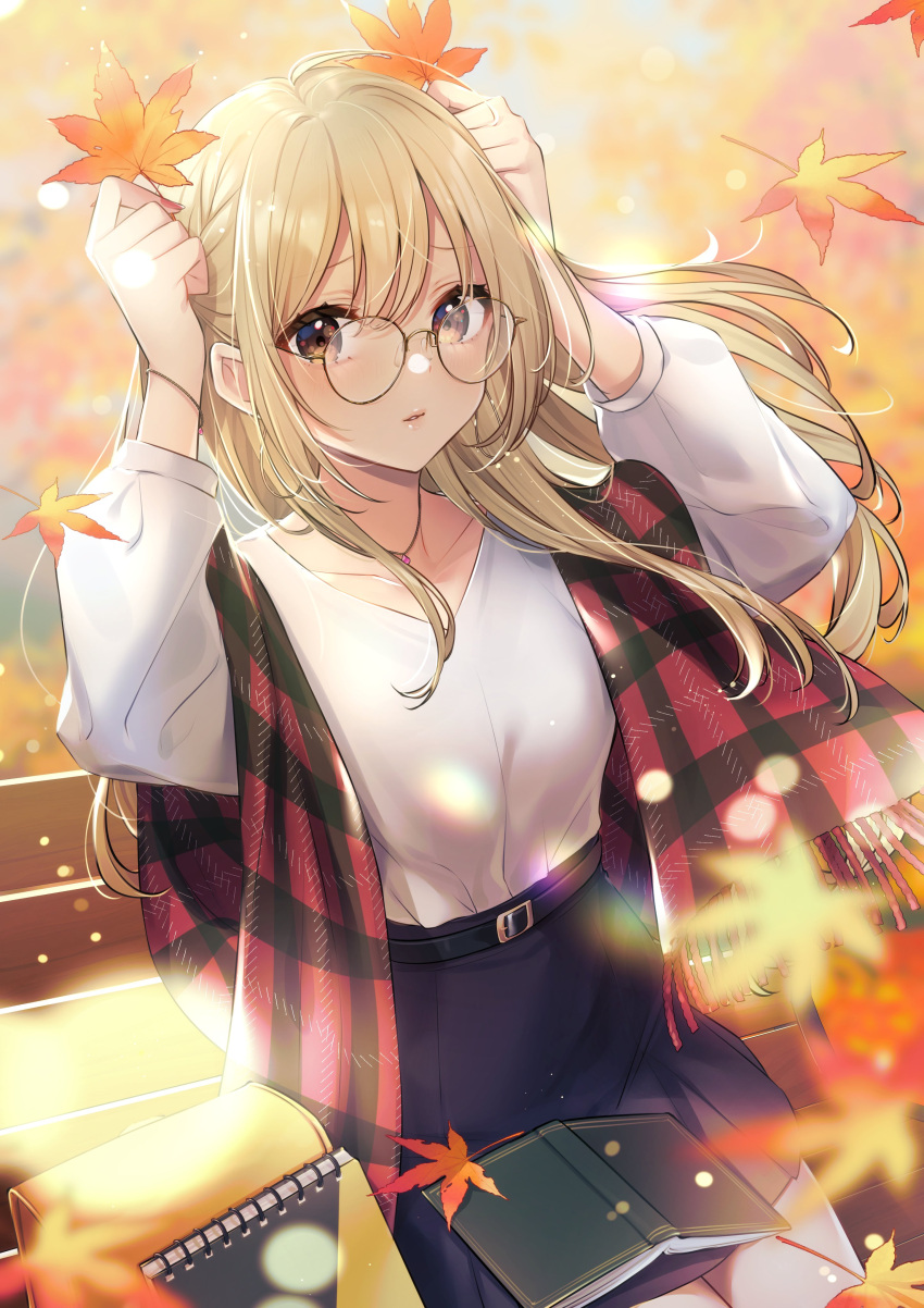 1girl :o absurdres autumn autumn_leaves bangs belt bench black_skirt blonde_hair blue_skirt blush brown_eyes collarbone falling_leaves glasses hands_up highres holding holding_leaf kitazume_kumie leaf long_hair long_sleeves looking_at_viewer maple_leaf notebook original outdoors parted_lips plaid plaid_scarf red_scarf round_eyewear scarf shirt sitting skirt solo white_shirt