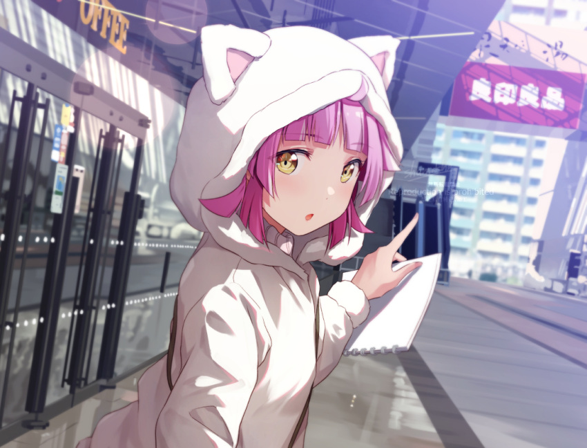 1girl animal_ears bangs birthday cat_ears commentary holding holding_sketchbook hood hooded_jacket jacket looking_at_viewer love_live! love_live!_nijigasaki_high_school_idol_club medium_hair pink_hair pointing shamakho sidelocks sketchbook solo tennouji_rina upper_body yellow_eyes