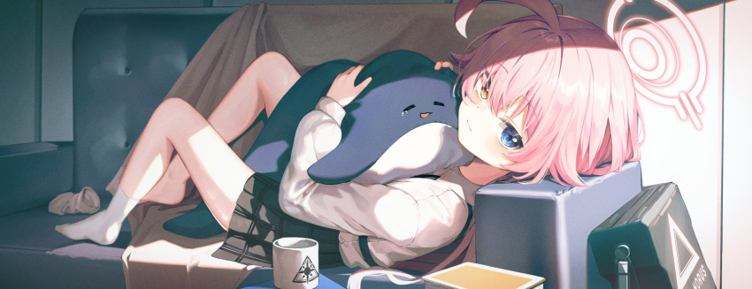 1girl ahoge blue_eyes couch cup green_eyes halo heterochromia highres knees_up looking_at_viewer lying mannack mug on_back on_couch original pleated_skirt skirt socks solo stuffed_animal stuffed_toy white_hair
