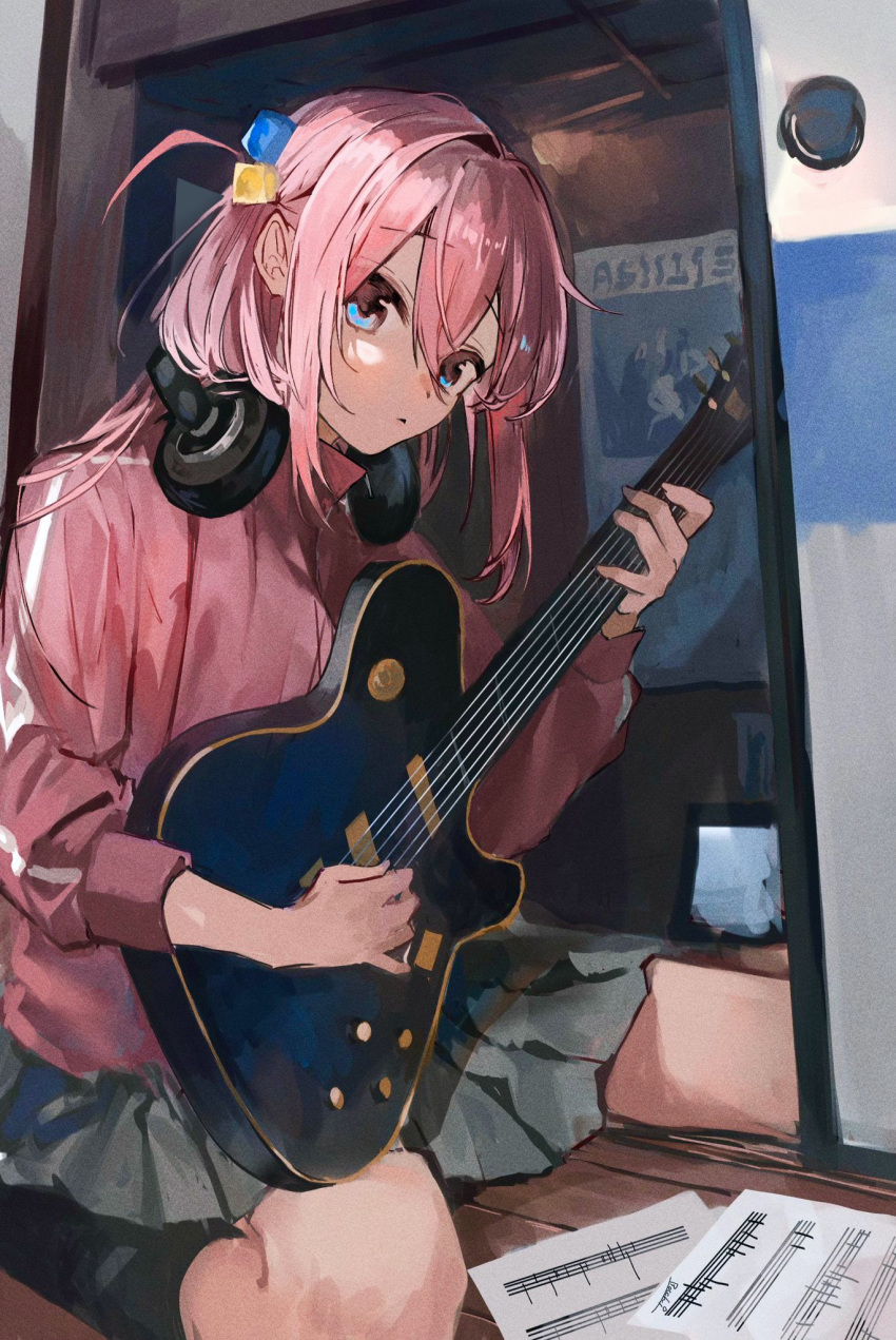 1girl bangs black_socks blue_eyes bocchi_the_rock! commentary_request cube_hair_ornament electric_guitar gibson_les_paul gotou_hitori grey_skirt guitar hair_between_eyes hair_ornament headphones headphones_around_neck highres holding holding_instrument indoors instrument jacket long_bangs long_hair long_sleeves looking_at_viewer muntai music one_side_up parted_lips pink_hair pink_jacket playing_instrument pleated_skirt sheet_music sitting skirt socks solo track_jacket wariza