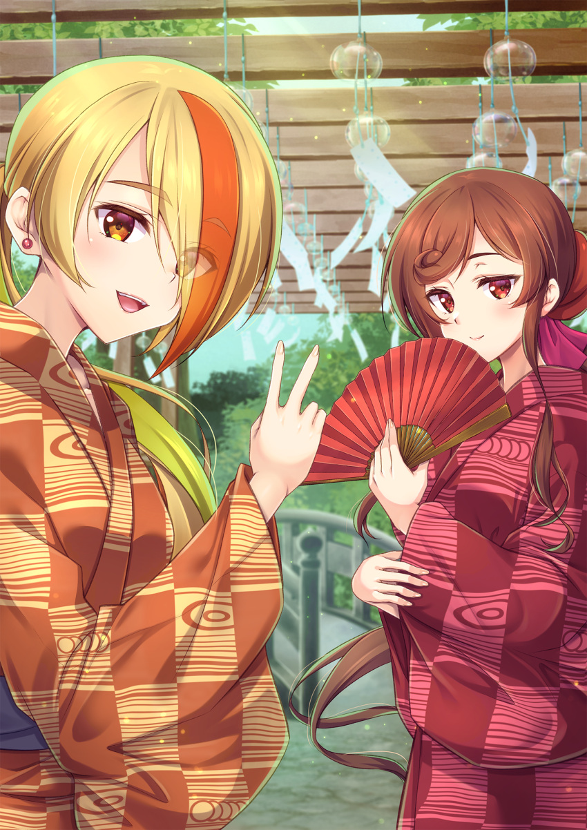 2girls :d blonde_hair blurry blurry_background brown_eyes brown_hair day eyes_visible_through_hair floating_hair hair_over_one_eye hand_fan highres holding holding_fan japanese_clothes kimono long_hair looking_at_viewer low_ponytail multicolored_hair multiple_girls murasaki_atsushi nikaidou_saki orange_hair orange_kimono outdoors red_eyes red_kimono shiny shiny_hair smile standing very_long_hair wind_chime yuugiri_(zombie_land_saga) zombie_land_saga