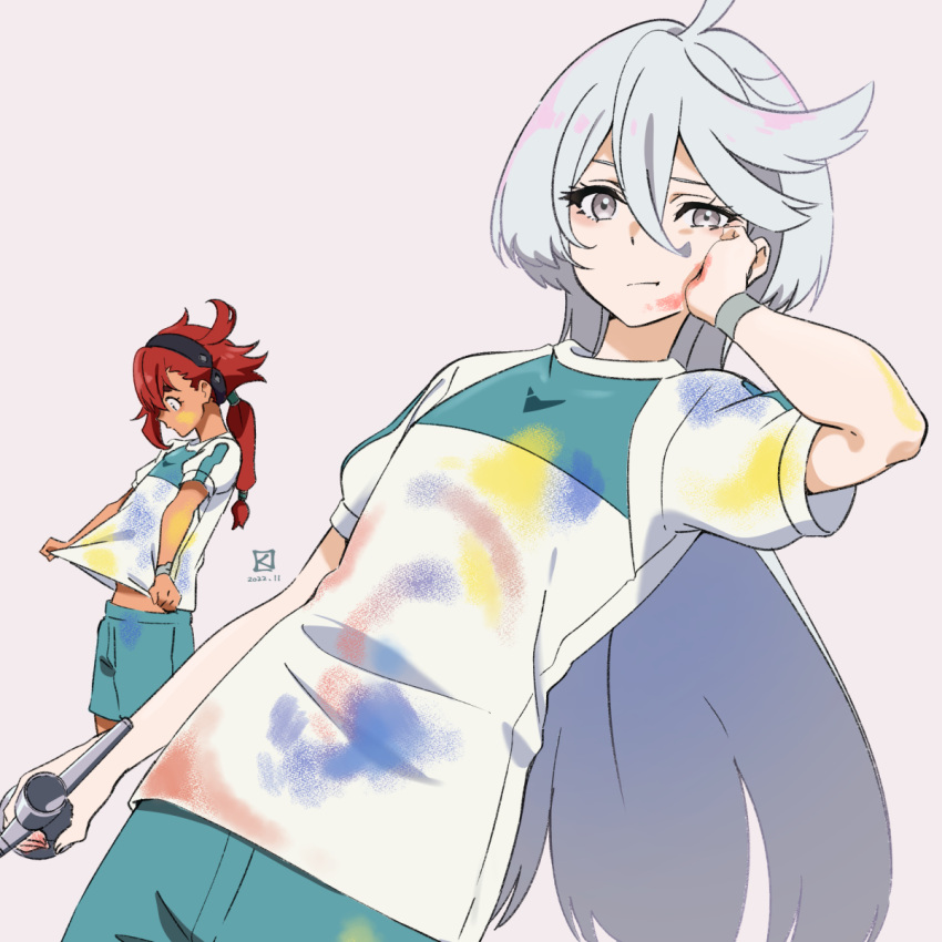 2girls ahoge artist_logo bangs closed_mouth dated green_shorts grey_eyes grey_hair gundam gundam_suisei_no_majo hair_between_eyes hairband hand_on_own_cheek hand_on_own_face highres long_hair looking_at_viewer low_ponytail miorine_rembran miyahara_takuya multiple_girls paint_on_clothes paint_splatter pink_background redhead shirt short_sleeves shorts simple_background solo_focus spray_paint suletta_mercury white_shirt wristband