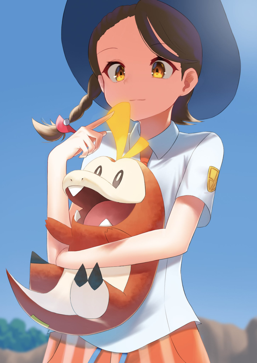 1girl bangs blue_headwear blurry blurry_background braid brown_eyes brown_hair closed_mouth commentary_request day fuecoco hand_up hat highres holding holding_pokemon index_finger_raised juliana_(pokemon) necktie orange_necktie orange_shorts outdoors pokemon pokemon_(creature) pokemon_(game) pokemon_sv shirt short_sleeves shorts sky smile yotoro_(uydn5542)