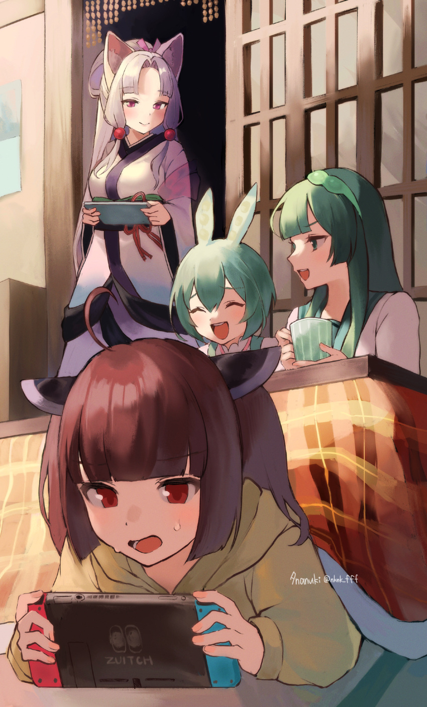 4girls absurdres ahoge animal_ear_fluff animal_ears bangs beads blush brown_hair closed_eyes closed_mouth commentary cup green_hair green_hairband green_suspenders grey_hair hairband handheld_game_console headgear highres holding holding_cup holding_handheld_game_console hood hoodie japanese_clothes kimono kotatsu long_hair long_sleeves looking_at_another lying multiple_girls nintendo_switch on_stomach open_mouth red_eyes siblings sidelocks sisters sweatdrop table tananuki touhoku_itako touhoku_kiritan touhoku_zunko twitter_username under_kotatsu under_table voiceroid voicevox watermark wide_sleeves zundamon