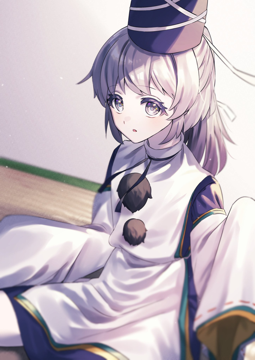 1girl blue_headwear blue_skirt blurry blush commentary depth_of_field grey_eyes grey_hair hat highres japanese_clothes kariginu long_hair mononobe_no_futo open_mouth pom_pom_(clothes) ponytail ribbon-trimmed_sleeves ribbon_trim skirt sleeves_past_fingers sleeves_past_wrists solo tate_eboshi touhou wankosoradayo wide_sleeves