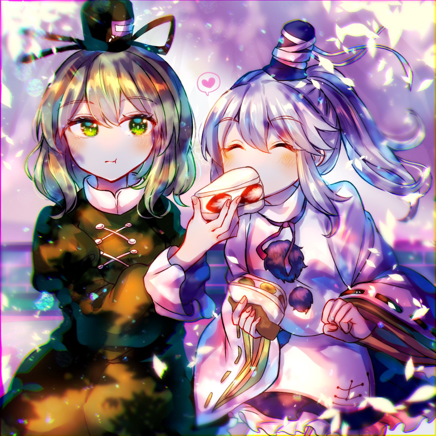 2girls :t bangs black_headwear black_skirt closed_eyes closed_mouth commentary_request cross-laced_clothes dress eating food frilled_skirt frills green_dress green_eyes green_hair grey_hair hat heart highres holding holding_food itsumizu japanese_clothes kariginu long_sleeves looking_at_viewer medium_hair mononobe_no_futo multiple_girls pom_pom_(clothes) ponytail ribbon-trimmed_sleeves ribbon_trim short_hair sitting skirt soga_no_tojiko spoken_heart tate_eboshi touhou