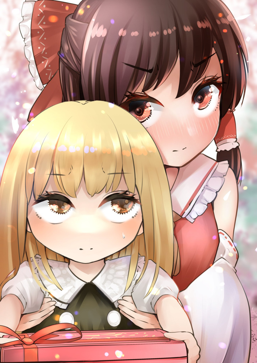 2girls bangs bare_shoulders blonde_hair blush bow box breasts brown_hair closed_mouth detached_sleeves expressionless foreshortening frilled_shirt_collar frills gift gift_box hair_bow hair_tubes hakurei_reimu highres holding holding_box incoming_gift kirisame_marisa long_sleeves looking_at_another looking_at_viewer looking_up multiple_girls no_headwear nodoguro_(phi-tan) outstretched_arms pink_eyes small_breasts touhou v-shaped_eyebrows yuri