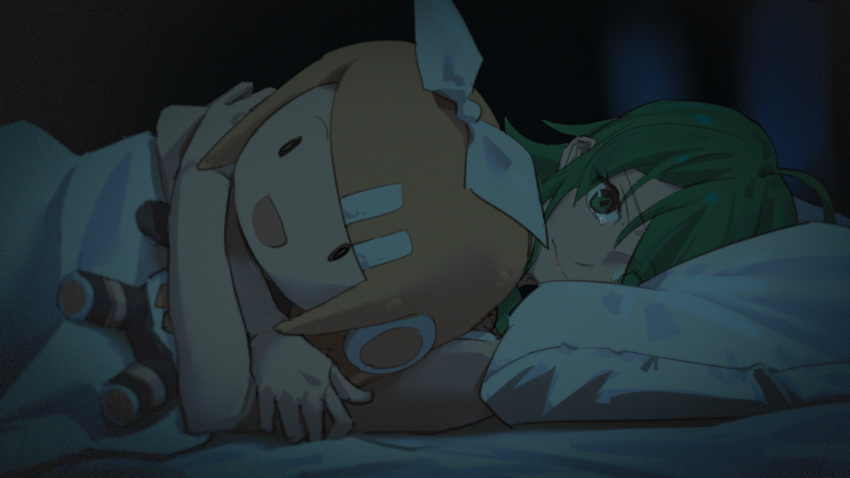 1girl ahoge bare_arms bed blanket blonde_hair bow character_doll commentary frown green_eyes green_hair gumi hair_bow highres indoors kagamine_rin lonely looking_at_viewer lying medium_hair night on_side pillow solo tearing_up under_covers vocaloid white_bow wounds404