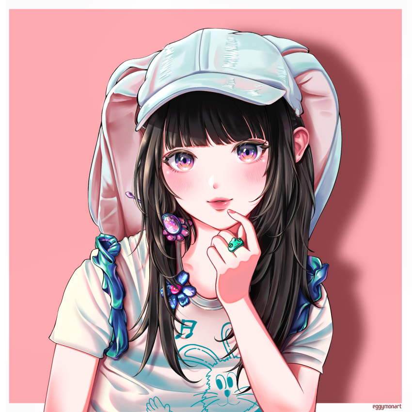 1girl animal_hat animification artist_name baseball_cap blue_headwear blush border eggymon hair_behind_ear hanni_(newjeans) hat highres jewelry k-pop long_hair looking_at_viewer newjeans parted_lips pink_background pink_eyes portrait print_shirt rabbit_hat real_life ring shirt smile solo white_border white_shirt