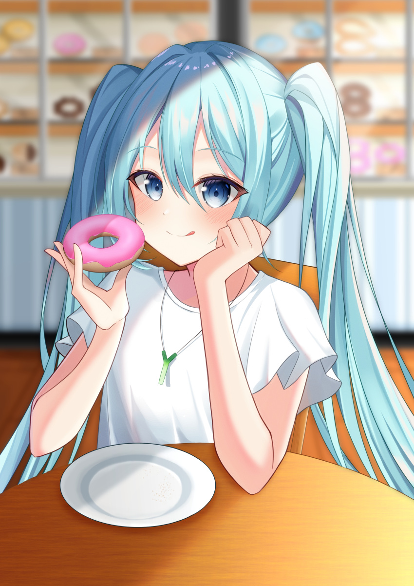 1girl absurdres blue_eyes blue_hair blurry blurry_background chair closed_mouth doughnut food hair_between_eyes hatsune_miku highres holding holding_food indoors jewelry long_hair pendant ryaru_ryaru shirt short_sleeves sitting solo table tongue tongue_out twintails upper_body very_long_hair vocaloid white_shirt