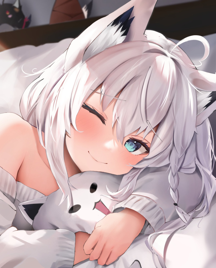 1girl ahoge animal_ear_fluff animal_ears aqua_eyes bare_shoulders bed_sheet blush braid close-up closed_mouth collarbone commentary_request crossed_bangs eyelashes fox_ears fox_girl furrowed_brow hair_between_eyes happy heart heart_ahoge highres hololive indoors long_hair long_sleeves looking_at_viewer lying object_hug on_side one_eye_closed shirakami_fubuki sidelocks single_braid smile solo stuffed_animal stuffed_toy sweater uechin_ewokaku white_sweater