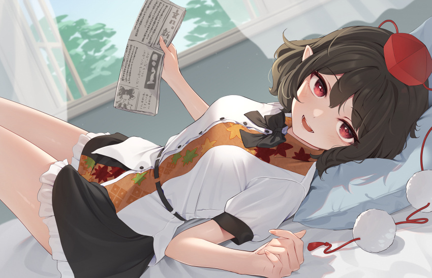 1girl bed_sheet black_hair black_skirt blush buttons collared_shirt commentary_request curtains fingernails frilled_skirt frills hair_between_eyes hakurei_reimu hat highres holding holding_newspaper kanpa_(campagne_9) looking_at_viewer newspaper on_bed open_mouth open_window pillow pointy_ears pom_pom_(clothes) red_eyes red_headwear shameimaru_aya shirt short_hair short_sleeves skirt smile solo tokin_hat touhou white_shirt window