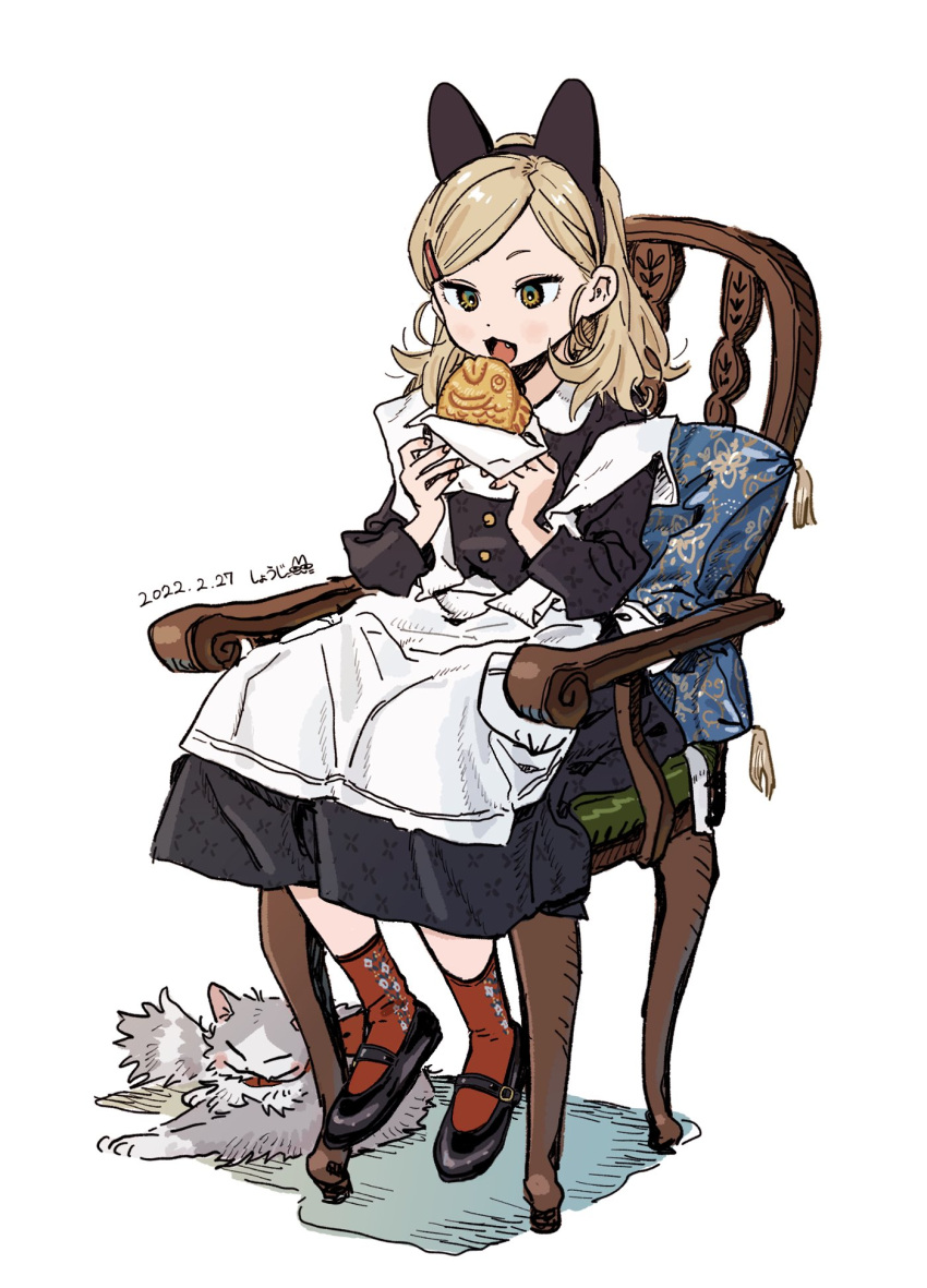 1girl animal_ears apron black_dress blonde_hair buttons cat cat_ear_hairband chair collar collared_dress commentary dated dress eating fake_animal_ears food fusuma_(nohbrk) green_eyes hair_ornament hairclip highres holding holding_food imminent_bite light_blush long_sleeves mary_janes medium_hair messy_hair on_chair open_mouth original parted_hair pillow red_socks shoes signature simple_background sitting socks solo taiyaki wagashi white_apron white_background white_collar wooden_chair
