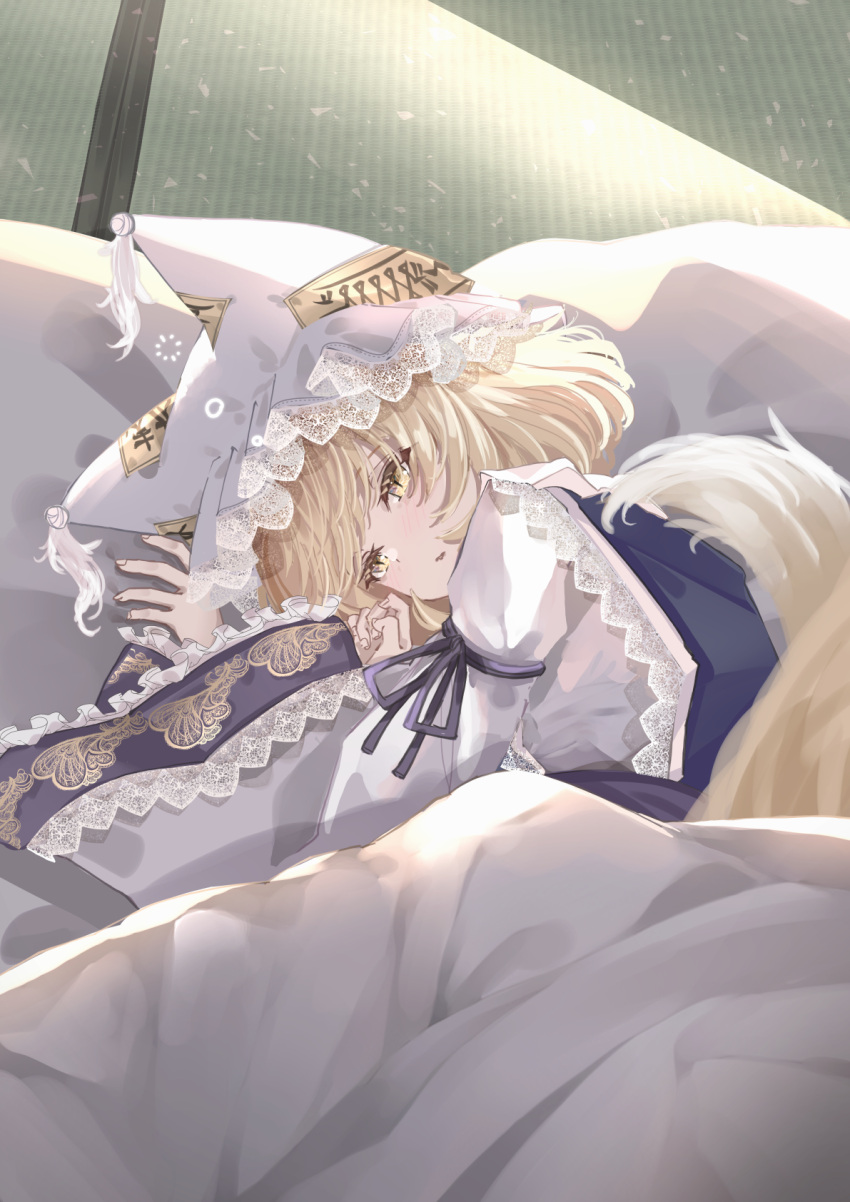 1girl animal_ears blonde_hair blush dress fox_ears fox_tail frilled_sleeves frills hat highres indoors long_sleeves lying mob_cap multiple_tails on_side parted_lips sarasadou_dan short_hair solo tail tatami touhou white_dress white_headwear wide_sleeves yakumo_ran yellow_eyes