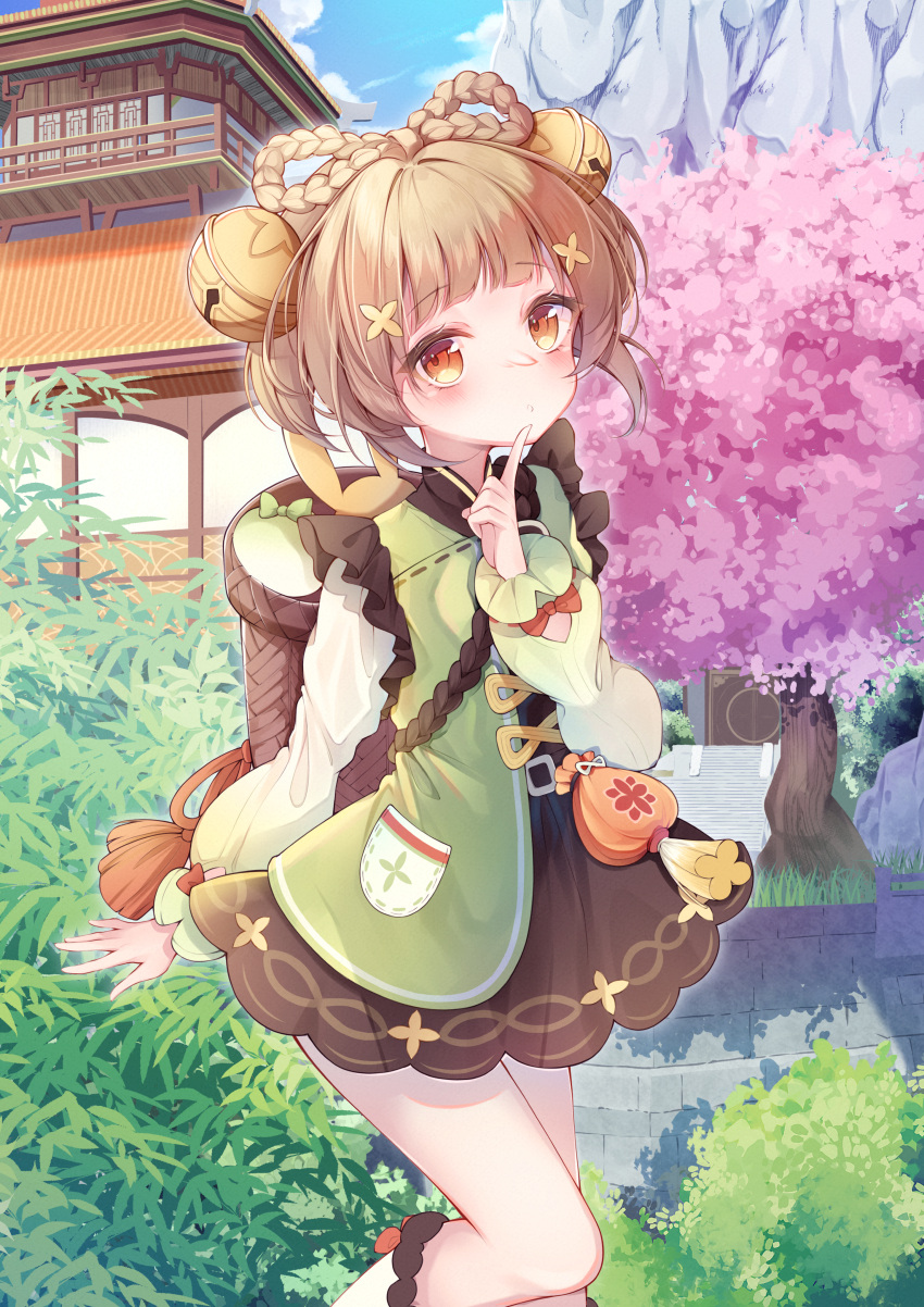 1girl absurdres arm_up basket bell blue_sky blunt_bangs blush bow-shaped_hair braid brown_eyes brown_hair cherry_blossoms clouds clover_print day dress eyebrows_hidden_by_hair finger_to_mouth genshin_impact hair_bell hair_ornament hat highres jingle_bell long_sleeves looking_at_viewer nayuuchan outdoors pocket qing_guanmao short_hair sidelocks sky temple turnip yaoyao_(genshin_impact)