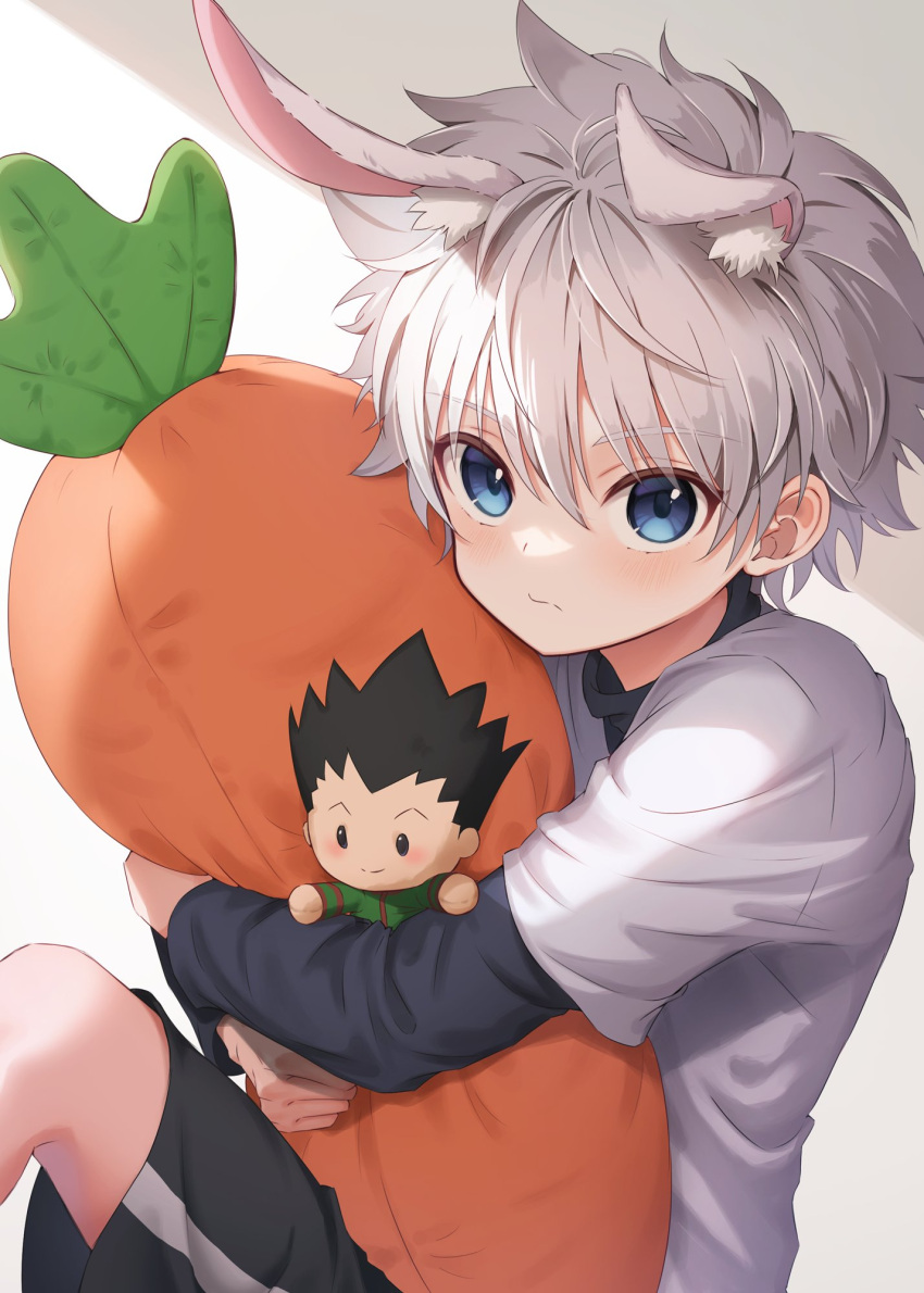 1boy animal_ears blue_eyes blush carrot_pillow character_doll closed_mouth extra_ears gon_freecss highres holding holding_pillow hunter_x_hunter killua_zoldyck layered_sleeves long_sleeves looking_at_viewer male_child male_focus object_hug pillow pillow_hug rabbit_ears shirt short_hair short_over_long_sleeves short_sleeves sitting stuffed_carrot usami_(usami_l) white_hair white_shirt