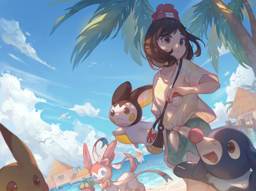 1girl bag blue_sky bounsweet brown_eyes brown_hair building clouds emolga highres holding holding_poke_ball medium_hair palm_tree pikachu poke_ball poke_ball_(basic) pokemon pokemon_(creature) popplio selene_(pokemon) shirt shorts shoulder_bag sky sylveon tree wingull zhutangyuan