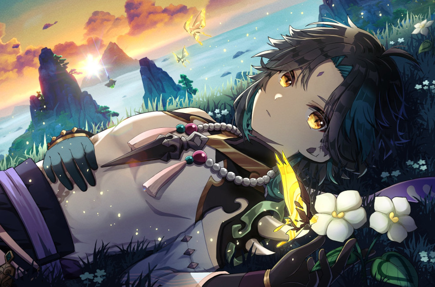 1boy ahoge armor belt black_gloves black_hair blue_flower blue_gloves blue_hair blue_sky bug butterfly butterfly_wings closed_mouth crystalfly_(genshin_impact) detached_sleeves eyeshadow facial_mark flower forehead_mark genshin_impact gloves gold_trim gradient_sky grass hair_between_eyes hand_on_own_stomach hands_up highres jewelry leaf light long_sleeves looking_at_viewer lying makeup male_focus mandarin_collar mountain multicolored_hair necklace ocean on_back orange_sky outdoors pearl_necklace purple_belt red_eyeshadow rock shirt short_hair shoulder_armor single_bare_shoulder single_detached_sleeve sky sleeveless sleeveless_shirt solo su34ma sun sunset tassel two-tone_hair water white_flower white_shirt wide_sleeves wings xiao_(genshin_impact) yellow_butterfly yellow_eyes
