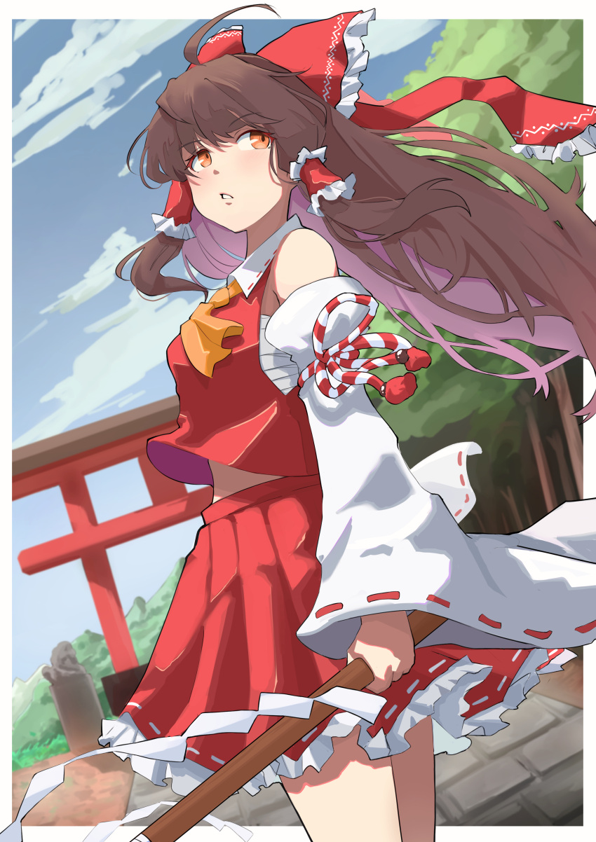 1girl absurdres ahoge blue_sky bow brown_hair chest_sarashi clouds commentary_request detached_sleeves feet_out_of_frame frilled_skirt frills hair_bow hair_tubes hakurei_reimu highres long_hair looking_at_viewer looking_to_the_side outdoors parted_lips red_bow red_shirt red_skirt ribbon-trimmed_skirt ribbon-trimmed_sleeves ribbon_trim sarashi shirt sidelocks skirt sky solo standing torii touhou tree yuuka_(a0240765)